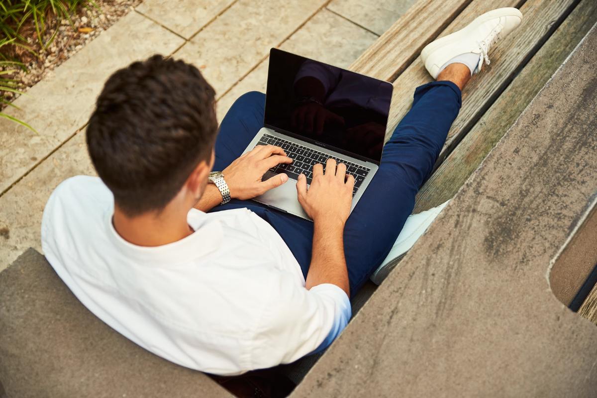 man-with-laptop-on-his-legs