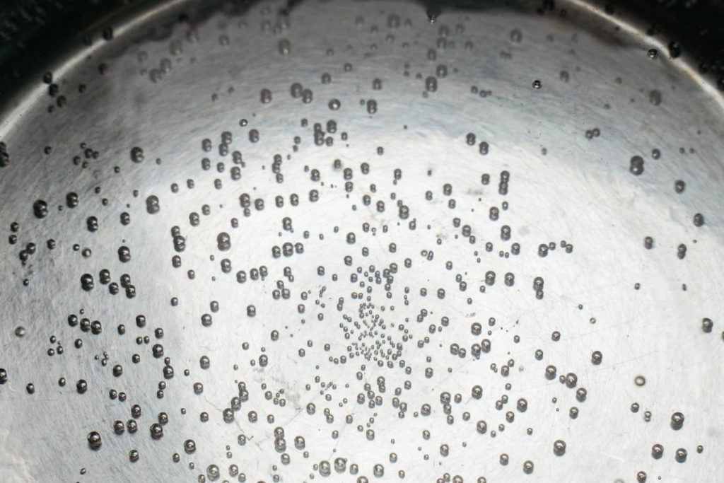 water simmers in pot